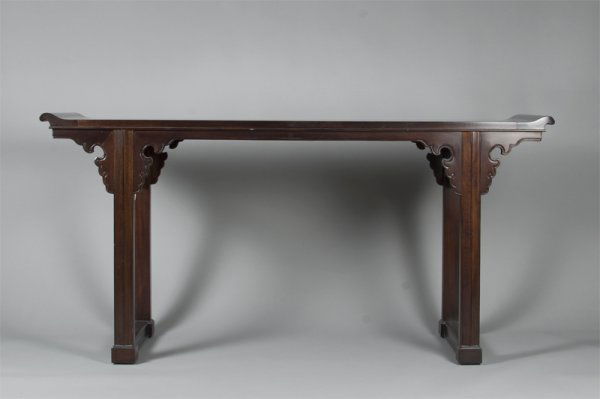 Chinese Qing Hardwood Altar Table: The recessed leg altar table, of plank rectangular top applied with two shaped flanges, over square straight legs and scrolling spandrels, joined at the ends by square stretchers. 66"L x 20"D x31.5"H.