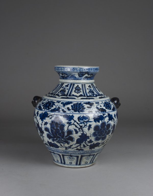 A Fine Chinese Ming Dynasty Large Vase, Hu: Of broad baluster shape, well painted in vivid cobalt blue tones with lotus blossoms, floral, scroll and leaf designs. Crackle underglaze in hu shape with two darker handles of animal form faces. 15" 