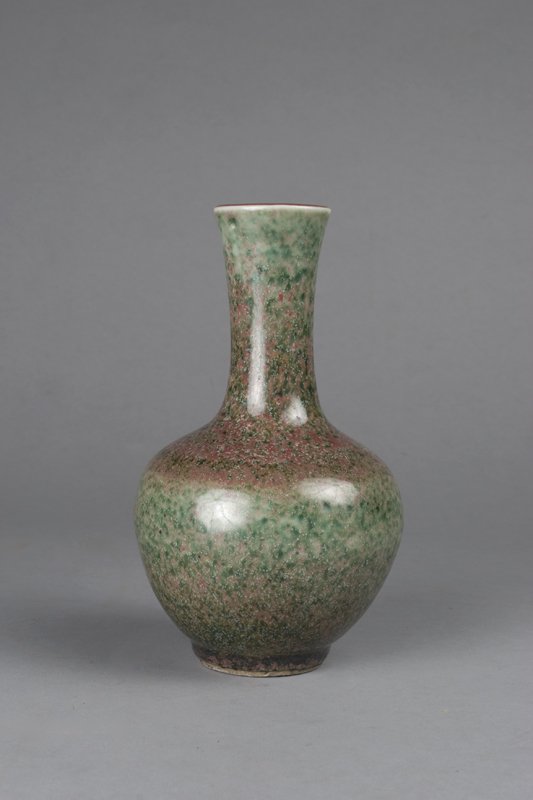 Chinese Langyao Peach Bloom Vase: 19th C. or earlier. Potted with slender neck above a compressed globular body. Light raspberry glaze running from rim with mottled green spots to the body. Unmarked. 7 & 3/8" H, craquelure throughout 