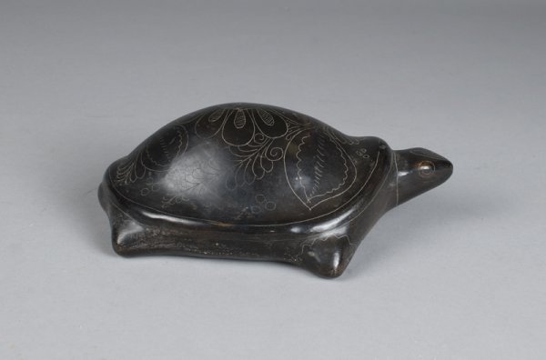 Native American Black Pottery Turtle: Black pottery turtle with etched designs of flowers and leaves on shell, etched feet, eyes and neck. 7.5" L, signed Jonala Sal on bottom. Minor areas of wear. Private collection Metamora, Michigan.