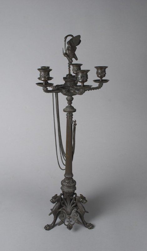 A Fine Grand Tour Bronze Figural Candleabra: Five arm bronze candleabra features a top finial with crane perched on a turtle. Scrolling leaf design on outer edge of candle holders as well as on top of candleabra. Center of candleabra is decorate