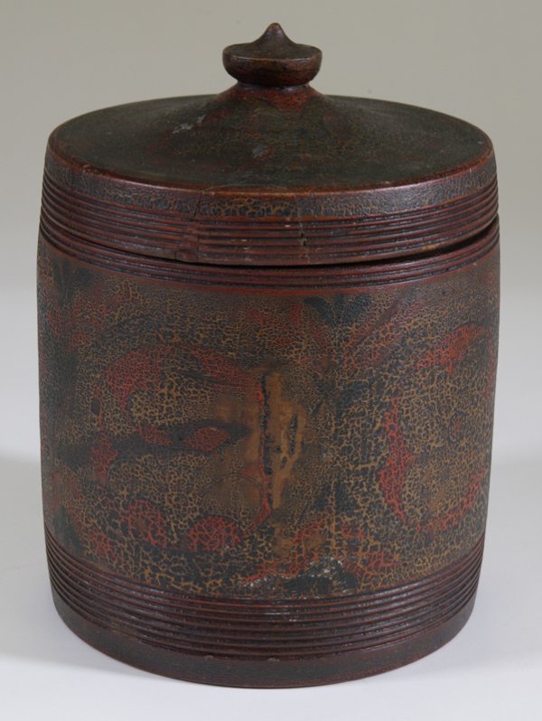 Mid. 19th C. American Painted Sugar Bucket: Turned wood bucket with fitted lid. Painted mostly in red, and large floral designs. 12" H, natural cracks in lid, and on very bottom. Paint has alligatoring throughout. Private collection Waterford, 