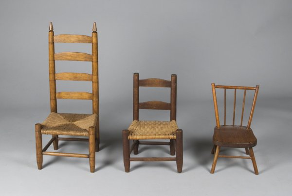 (3) Early American Child's Chairs, 19th C.: A tall ladderback with turned finials with four slats and rush seat, 29" H. A pine plank seat Windsor with turned spindles and four stretcher bars in early red stain finish, 16.5" H. And a ladderback 