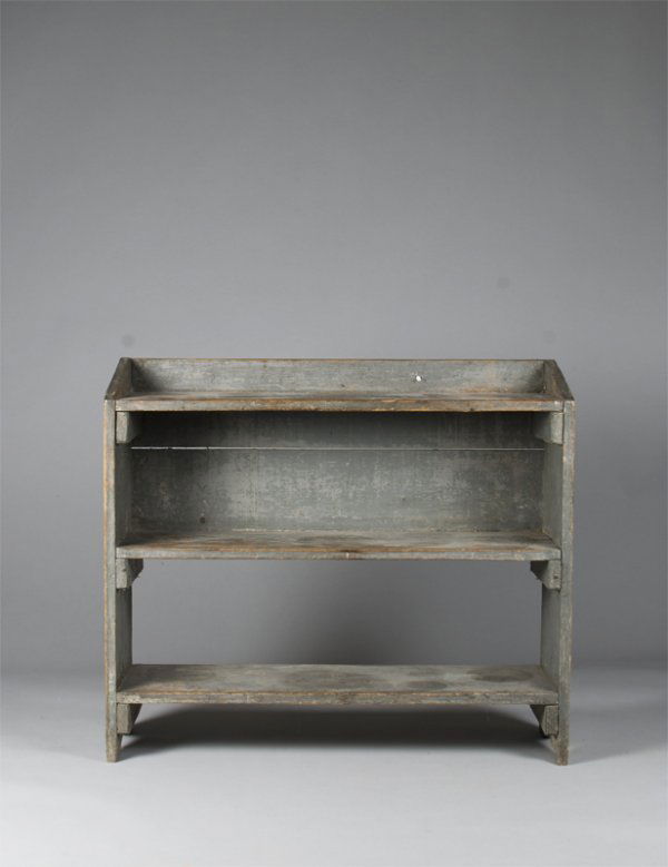 19th Century American Bucket Bench In Robin Eggs: The bench with 3 shelves, backsplash, and boot jack ends in original robbin egg blue turning a greyish color with age. 33"Hx37"Lx12.5"D, age splits, some added nails, otherwise a very good early bench