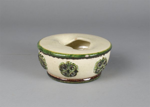 A Very Nice Creamware Spittoon 18th/Early 19th C.: The body with 6 applied roundels, shaped opening all in a green, brown and cream glaze. 6.5"Dx3"H, small glaze chip, a very nice, unusual and early spittoon.