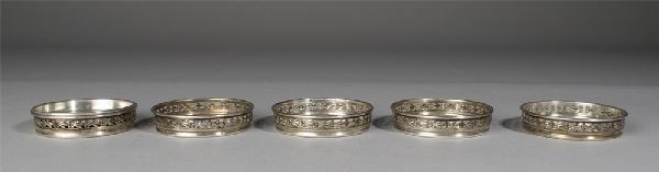 6 Antique Birks Sterling Coasters: Includes single solid coaster, together with 5 glass with floral Sterling edge coasters. 217 grams TW, all marked.