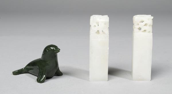 Pair of Chinese Soapstone Chops & Jade Seal: Includes a pair of carved soapstone chops, plain, 2.75" H. Together with a carved dark green jade seal (animal), 1.5" H x 2.5" L.