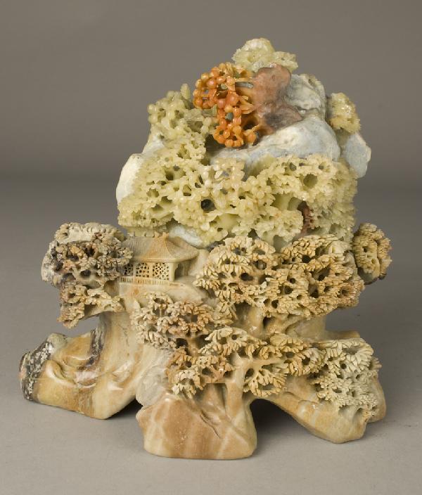 Large Chinese Soapstone & Jade Carving: Depicting large trees with home and carved jade leaves above with rocky landscape. 8.5" H x 8.5" W, chip to very top in green and orange area,
