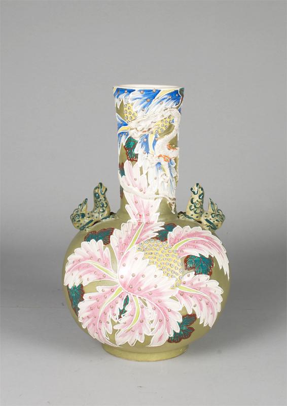 A Fine And Large Chinese Dragon Vase: The bottle shaped vase with applied foo lions and dragons, the body enameled with flowers against a tea dust ground. 16"H x 10"W, Circa 19th C.