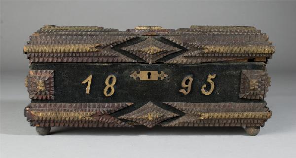 Very Fine Antique Tramp Art Sewing/Jewelry Box: Box decorated with navy velvet, stained from age. Applied wooden date to front, 1895, and top n g. Lion head brass pull, resting on 4 ball feet. Interior lid with print of men, crest and crown which s