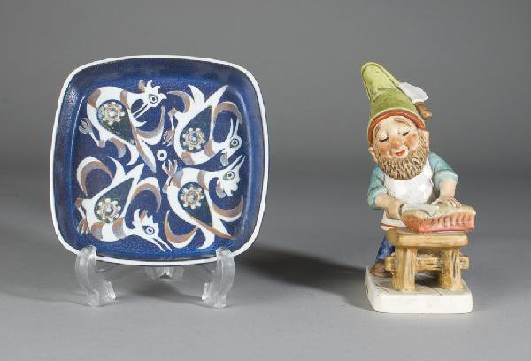 Royal Copenhagen Trinket Dish & Hummel: Royal Copenhagen square dish in cobalt decorated with birds, #708/2883, unknown artist. Together with a Hummel figurine of elf cutting bread, 1982 on bottom, chip to knife on hat.