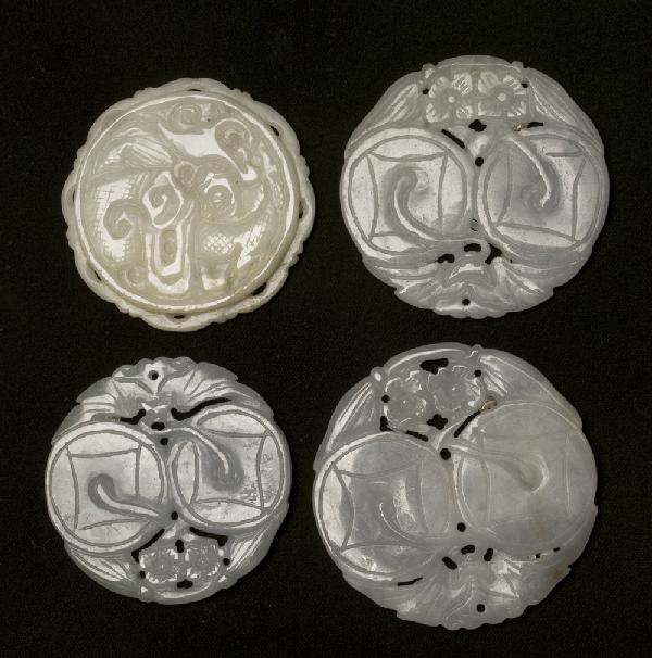(4) Chinese Qing Carved Jade Plaques: Light green jade, 3 depict two Chinese coins with bats and floral designs, largest 2 & 1/8" Dia. Together with light green plaque carved to depict raised dragon with scrolled scalloped edge on one sid