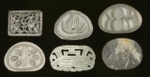 (6) Chinese Qing Carved Jade Medallions: Finely carved and all translucent jade. Includes a medallion with carved beetle form on top and two small holes in center. A medallion with carved bug form on top and two small holes in center. A meda