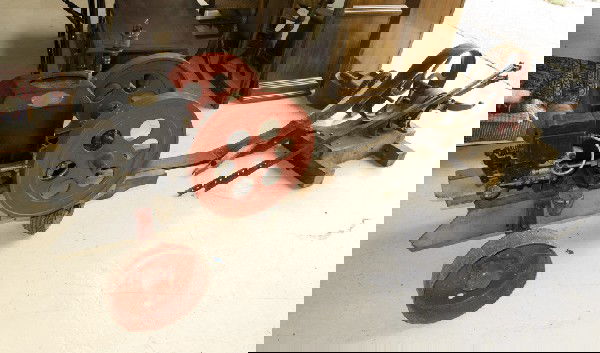 Stover Type "K" Hit Miss Engine: Mounted on three wheel carriage, with pulley measuring 6" Dia. X 4" L. Includes the water well pump jack with belt, measuring 4" W. Marked on plate Stover Type "K" Engine Mfg. By Stover Mfg. & Engine