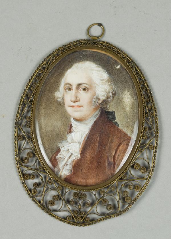 A Very Fine Miniature George Washington 18th C: Finley painted on ivory to depict a young George Washington in red coat, mounted in a brass filigree frame with beveled glass, the hanging loop with a flat spot with the initials ME, the reverse with