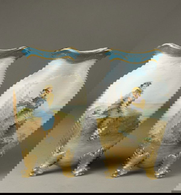 Pr. Of Hand Painted Sevres Style Porcelain Vases: Both finely painted, top decorated in blue Celeste with gilt highlights, resting on four feet in gilt. First depicts a young girl sitting with a fishing line in the water with sail ships on the revers