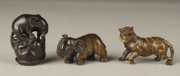 ( 3 ) Finely Carved Japanese Boxwood Netsuke's: One carved to depict a tiger with ivory plaque on bottom, with inset glass eyes, 2.375" L, one carved to depict 2 rats fighting, with inset glass eyes, signed on bottom, 1.875" H, and one carved to de