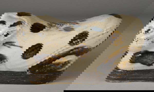 Chinese Cat Form Pottery Pillow: Finely painted to depict a cat. The top with flowers, retains remnants of old wax export seal. 9.5" W x 5.5" H. .5" glaze loss, hardly noticeable with several glaze anomoles. Circa 1850.