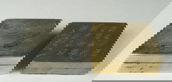 ( 2 ) Chinese Metal Ink Paste Boxes: One with raised mountain designs in silvered metal, one in brass, with calligraphy, and a impressed four character mark within a square, largest is 4." square, 19th, early 20th century.