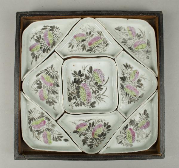 Chinese Famille Rose Sectional Supper Set: The nine piece sectional supper set finely enameled with lotus and lingzi, in fitted lacquered wood box. The box signed in three places. 10.25" x 10.25". Small chip to one section, the box with stress