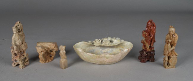 (6) Chinese Carved Soapstone Figures: Carved to depict various figures including three elders, in a soapstone chop depicting a lady holding an umbrella, a soapstone brush washer with carved lily pads and a frog, and a soapstone stand carv