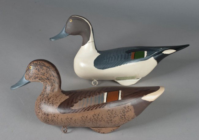 Drake Pintail Duck & Hen Decoys~Harry Jobes: Original paint, with keel and ring on bottom. Male measures 9" H x 18" L, and female measures 9" H x 16" L. Tag to both on underside reads, "Superior pair of Pintails Capt. Harry Jobes Upper Chesapeak