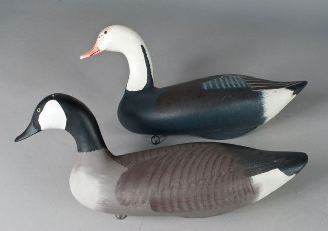 Blue & Canadian Goose Decoys~Harry Jobes: Original paint with keel and ring on underside. Blue goose measures 11.5" H x 20" L, and signed Capt. Harry Jobes on underside near tail. Canadian goose measures 10.75" H x 21" L, and signed Capt. Har