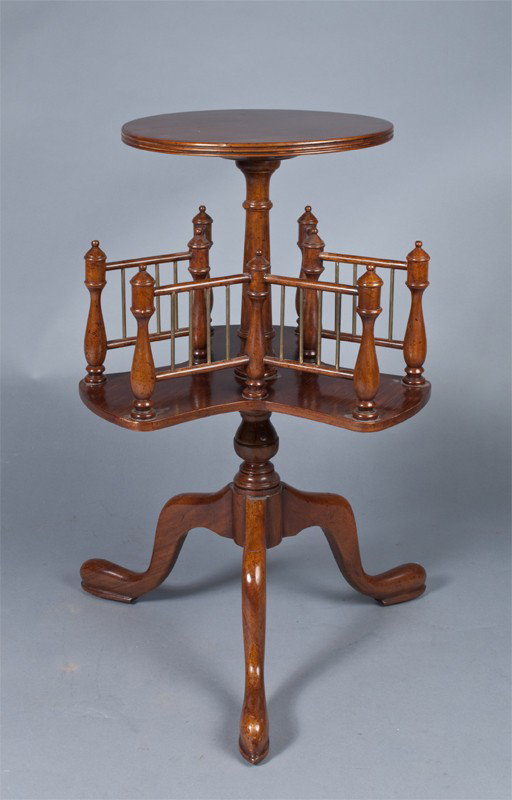 Occasional Table with Turning Magazine Rack: By Maitland Smith, small table rests on three legs, center magazine rack in three sections spins full rotation, followed by stationary top. 28.25" H x 21" W, normal wear consistent with use.