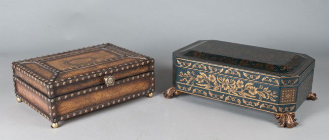 (2) Ornately Decorated Hinged Boxes: Includes a box decorated with old world map designs, followed by tacks throughout, resting on four ball feet. Knob on front opens lid, 5.5" H x 14.25" W x 10.5" D. Together with a box decorated in nav