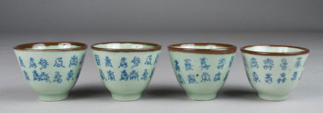 (4) Chinese Porcelain Tea Cups: Green celadon hue cups with Chinese caligraphy around. Each with four character mark in underglaze blue on underside. 2.5" H, all with crazing throughout.