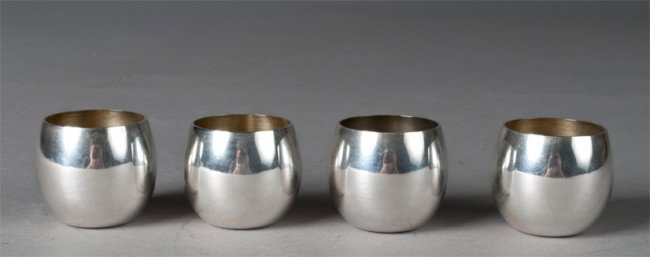 (4) Tiffany & Co. Sterling Shot Glasses: Small sterling shot glasses with gold wash interior, 1.5" H, marked Tiffany & Co. Makers Sterling 25005 on underside. 4.1 ounces TW.