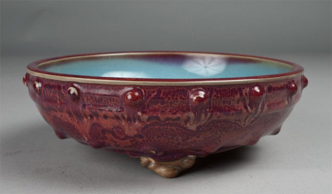 Chinese Narcissus Strawberry Glazed Open Bowl: With powder blue interior, the body decorated with two rows of raised beads on the ruyi feet, the bottom with a molted brown color signed with one character, 8.25"D X 3"H.