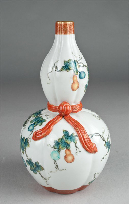 A Fine Chinese Famille Rose Gourd Vase: With molding ribbon and finely painted to depict fruit trees with bats, the bottom with Chinese seal mark in iron red and gilt, 9.75"H.