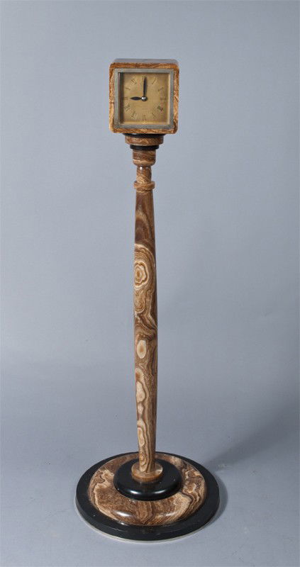 A Fine Art Deco French Clock On Quartz Pedestal: The clock signed A L emeraude, Lausanne, encased in quartz or marble, and mounted on top of a column shaped pedestal in quartz or marble, very nice and heavy, 42" H, circa 1920's.