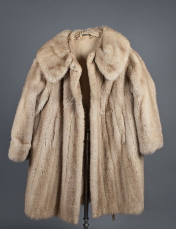Ladies Medium Length Mink Coat: In shades of tan and light brown, probably a size 8, circa 1950's.