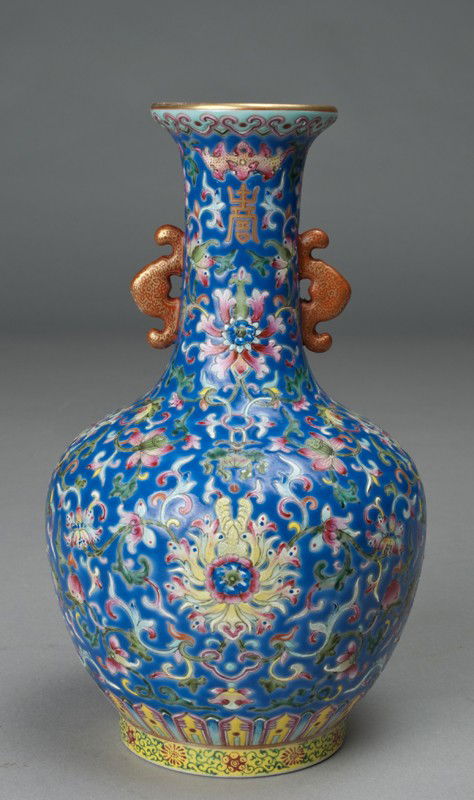 Fine Chinese Famille Rose Porcelain Vase: Finely enameled to depict lotus, with ruyi shaped handles, signed with seal mark on the underside, 8.25"H, private collection Grosse Pointe Shores, MI.