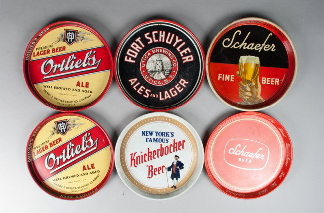 (6) Vintage Beer Advertising Trays: Includes two different styles of Shaefer Beer, (2) Ortlieb's Ale, Knickerbocker Beer, and Fort Schuyler Ales and Lager. All in good condition with wear consistent with age and use.