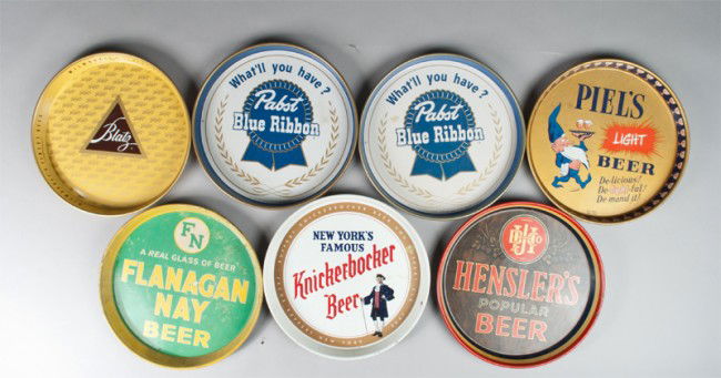 (7) Vintage Beer Advertising Trays: Includes Blatz, Piel's Light Beer, (2) Pabst Blue Ribbon, Flanagan Nay Beer, Hensler's Popular Beer, and Knickerbocker Beer. All in good condition with wear consistent with age and use.
