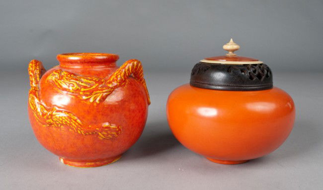 (2) Japanese Porcelain Incense Burner: To include a coral red porcelain with ivory mounted wood covered sensor the bottom with original paper label, together with a red glazed porcelain jar with a red molted dragon and three handles, the b