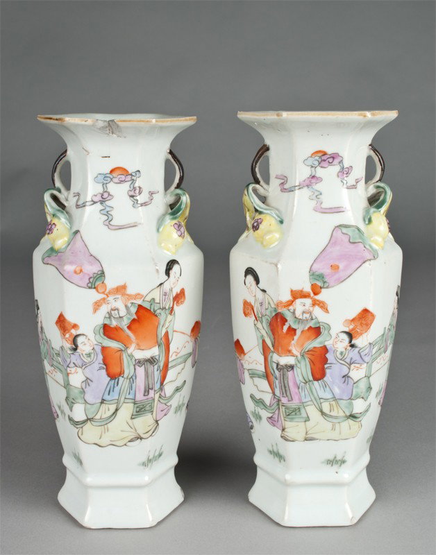 Pr. Chinese Republic. Porcelain Vases: The six sided vases with two handle attached to molded fruit, the body painted with figures and bats, each 9.25"H, one with rim chip.