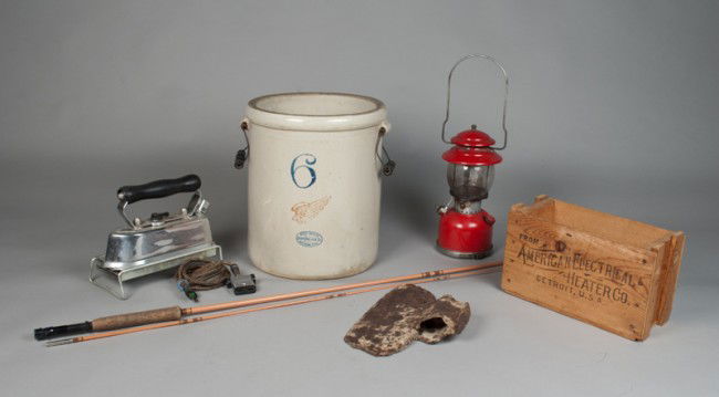 (5) Piece Primitive Lot: Includes a large two handled Redwing 6 gallon crock, a Coleman kerosene lantern, an American Beauty iron with stand, an iron axe head, and a Wonderod fishing pole with case. Tallest 14.5" H. Good, use