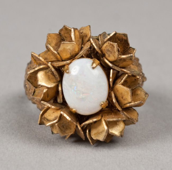 Signed Miriam Haskell Opal Ring: With floral decoration surrounding the opal, size 6, mid 20th century.