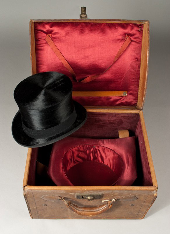 Antique Knox Tophat with Carrying Case: Fine black fabric tophat with silke interior with heavy lined case with brass locking mechanism (no key) and with hat form. Wear consistent with age and use.