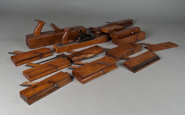 Large Grouping of Antique Carpenter's Planes: Includes 16 planes, one signed W. Blake, one with impressed anchor symbol, one signed Hall Case, and three signed Ohio Tool Co. W.M. Shurkey. Longest measures 16" L.