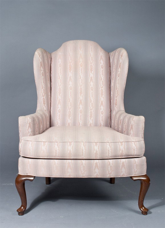 Drexel Queen Anne Wingback Chair: Upholstered in mauve with white and blue accents. 45" H x 31" W x 26" D. Staining to upholster with minor scratches to wood legs.