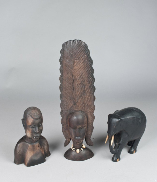 (3) African Carved Wood Figures: To include an elephant with bone or ivory tusks, a native with carved details, and a native female with large headpiece and bone and bead neckpiece, all early 20th century and very well done, tallest 