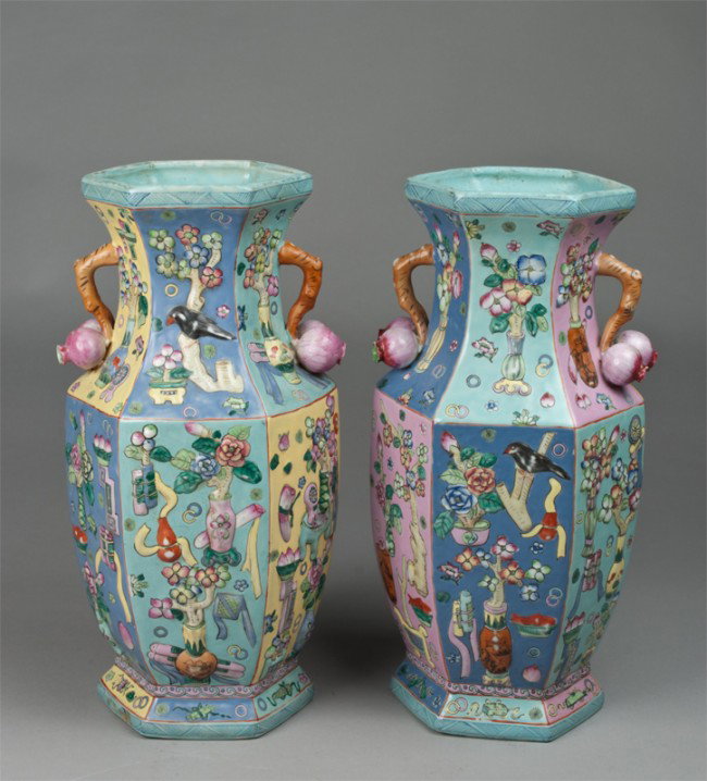 Pr. Of Chinese Famille Rose Vases: Six paneled vases decorated with raised antiques in various colors, with peach and stem handles. Six character mark within a square in iron red on underside. 16" H, 19th century. Some paint wear where