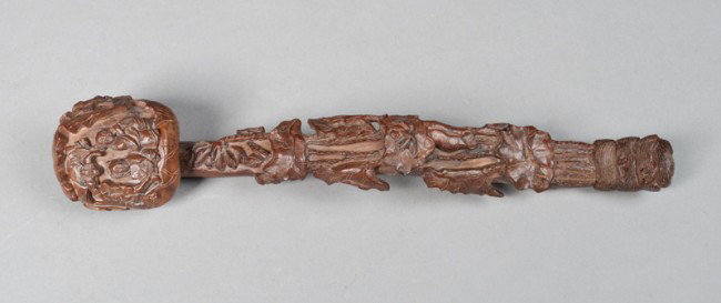 Fine Chinese Carved Wood Ruyi Scepter: Finley carved to depict figures within a landscape and bats, the stem in the shape of branches further carved with openwork flowers and foliage, the tip of the handle carved to depict being wrapped in