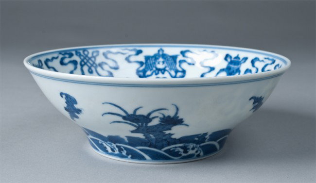 Chinese Blue and White Porcelain Bowl: Footed bowl, interior decorated with central floral medallion, with floral, seashell, fish, symbol and scrolling designs. Exterior decorated with ruyi and flying bats. Six character mark in underglaze