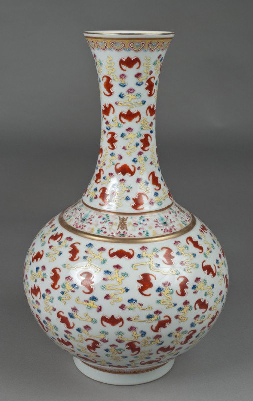 A Fine Chinese Famille Rose Porcelain Vase: Finley enameled to depict bats amongst lotus, the rim and neck with gilt trim, the base with six character mark in iron red, 16"H, circa early 20th century.